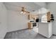 Bright eat-in kitchen area with a ceiling fan and a partial view of the appliances at 3150 Soft Breezes Dr # 2046, Las Vegas, NV 89128