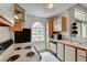 Bright kitchen features white cabinetry, black appliances, and a window offering natural light at 3150 Soft Breezes Dr # 2046, Las Vegas, NV 89128