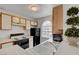 Kitchen features white cabinets and countertops, with black appliances and a window at 3150 Soft Breezes Dr # 2046, Las Vegas, NV 89128