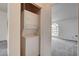 Efficient laundry closet with stacked washer and dryer, conveniently located near the bedroom and main living spaces at 3150 Soft Breezes Dr # 2046, Las Vegas, NV 89128