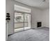 Spacious living room with a fireplace and sliding glass doors leading to an outdoor balcony at 3150 Soft Breezes Dr # 2046, Las Vegas, NV 89128