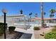 A community pool with a pergola and various lounge chairs, perfect for relaxing at 3150 Soft Breezes Dr # 2046, Las Vegas, NV 89128