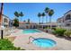 Relaxing pool and spa area surrounded by palm trees and lounge chairs at 3150 Soft Breezes Dr # 2046, Las Vegas, NV 89128