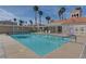 Bright community pool with blue railings and nearby cabana at 3150 Soft Breezes Dr # 2046, Las Vegas, NV 89128