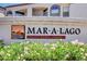Landmark sign 'Mar-a-Lago', a Desert Shores Community, surrounded by flowering plants, creating a welcoming entrance at 3150 Soft Breezes Dr # 2046, Las Vegas, NV 89128