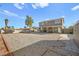 Spacious backyard features a low maintenance gravel landscape, covered patio, and block wall at 3208 Alcoa Ave, Las Vegas, NV 89102