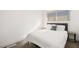 Bedroom featuring a queen-size bed, gray headboard, and natural lighting at 3208 Alcoa Ave, Las Vegas, NV 89102