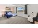 Bright bedroom featuring a plush bed, large window overlooking the neighborhood, and a comfortable chair at 3208 Alcoa Ave, Las Vegas, NV 89102