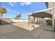 View of carport, gravel area, and billboard in a large, versatile backyard space at 3208 Alcoa Ave, Las Vegas, NV 89102