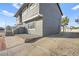 Two story home with gated driveway, small front yard, and neutral color scheme at 3208 Alcoa Ave, Las Vegas, NV 89102