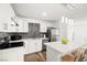 Bright kitchen with white cabinetry, stainless steel appliances, and a tiled backsplash at 3208 Alcoa Ave, Las Vegas, NV 89102