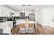 Modern kitchen featuring white cabinetry, stainless steel appliances, and kitchen island at 3208 Alcoa Ave, Las Vegas, NV 89102