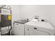 Laundry room featuring washer, dryer, and water heater at 3208 Alcoa Ave, Las Vegas, NV 89102
