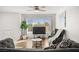 Bright living room with ceiling fan, big windows, modern furniture, and light-colored flooring at 3208 Alcoa Ave, Las Vegas, NV 89102