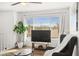 Inviting living room featuring a comfortable armchair, large window and bright natural light at 3208 Alcoa Ave, Las Vegas, NV 89102