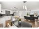Bright living room featuring a modern kitchen, dining area and a comfortable seating arrangement at 3208 Alcoa Ave, Las Vegas, NV 89102