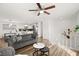 Cozy living room with white walls, wood floors, modern sofa and staircase view at 3208 Alcoa Ave, Las Vegas, NV 89102