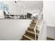 Bright staircase leading to upper floor living space with white railings at 3208 Alcoa Ave, Las Vegas, NV 89102