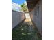 Narrow backyard featuring block wall and storage structure at 3314 Arapaho, Las Vegas, NV 89169