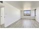 Spacious bedroom with a large window and modern wood-style flooring at 3930 University Center Dr # 311, Las Vegas, NV 89119