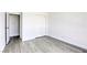 Neutral bedroom featuring wood-style flooring and a double closet at 3930 University Center Dr # 311, Las Vegas, NV 89119