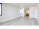 Large, open bedroom with wood-look floors and neutral walls at 3930 University Center Dr # 311, Las Vegas, NV 89119