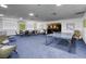 Spacious common area with tables, chairs, lounge furniture, and a ping pong table for recreation at 3930 University Center Dr # 311, Las Vegas, NV 89119