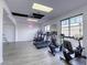 Well-lit gym with treadmills, stationary bikes, and views from the windows, plus a neon sign at 3930 University Center Dr # 311, Las Vegas, NV 89119