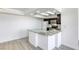 Modern kitchen with white cabinets, granite countertops, and stainless-steel appliances creating a stylish cooking space at 3930 University Center Dr # 311, Las Vegas, NV 89119
