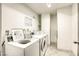 Clean, well-maintained laundry room featuring multiple washing machines and laundry tips posted at 3930 University Center Dr # 311, Las Vegas, NV 89119