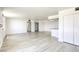 Bright, open living area with wood-look floors, flowing into the kitchen, and featuring plenty of natural light at 3930 University Center Dr # 311, Las Vegas, NV 89119