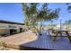 Outdoor kitchen area with BBQ grills, picnic tables, and a deck for community gatherings at 3930 University Center Dr # 311, Las Vegas, NV 89119