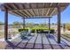 Covered outdoor lounge area offering shade with comfortable seating by the community pool at 3930 University Center Dr # 311, Las Vegas, NV 89119