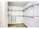 A walk-in closet with custom metal shelving and wood-look floors offering storage solutions at 3930 University Center Dr # 311, Las Vegas, NV 89119