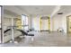 Large weight room featuring weight lifting machines, free weights, mirrors, and bright lighting at 3930 University Center Dr # 311, Las Vegas, NV 89119