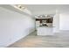 Open floor plan includes a kitchen with wood cabinets and a breakfast bar at 3930 University Center Dr # 312, Las Vegas, NV 89119