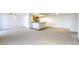 Large, bright living room and kitchen area with hardwood and carpeted floors, and modern lighting fixtures at 3930 University Center Dr # 312, Las Vegas, NV 89119
