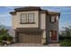 Charming two-story home with a tile roof and a two-car garage, showcasing a modern and inviting design at 4204 Mount Bonnell Ave, North Las Vegas, NV 89081