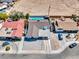 A high angle shows the backyard pool of the home and the gravel-covered front yard and driveway at 4417 Saint Andrews Cir, Las Vegas, NV 89107