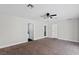 Spacious bedroom with neutral carpeting, ceiling fan, and ample natural light at 4417 Saint Andrews Cir, Las Vegas, NV 89107