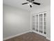 Bedroom featuring neutral walls and carpets, and bi-fold doors at 4417 Saint Andrews Cir, Las Vegas, NV 89107