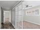 Bedroom featuring new carpet, sliding closet doors, and natural light at 4417 Saint Andrews Cir, Las Vegas, NV 89107