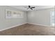 Bedroom with ceiling fan, shuttered windows, and carpet flooring at 4417 Saint Andrews Cir, Las Vegas, NV 89107