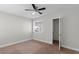 Bedroom with ceiling fan, window with blinds, and walk-in closet at 4417 Saint Andrews Cir, Las Vegas, NV 89107