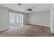 Bedroom with plush carpet, fan, and french doors leading to the exterior at 4417 Saint Andrews Cir, Las Vegas, NV 89107