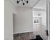 Bright, modern entry featuring wood floors, neutral paint, and a view into the open living space at 4417 Saint Andrews Cir, Las Vegas, NV 89107