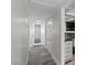 Hallway with storage and an updated bathroom with a glass bowl sink and stone accents at 4417 Saint Andrews Cir, Las Vegas, NV 89107