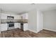 Compact kitchen featuring stainless steel appliances, white cabinets, and tiled backsplash at 4417 Saint Andrews Cir, Las Vegas, NV 89107