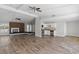 Open-concept living space with fireplace and a seamless transition to the kitchen at 4417 Saint Andrews Cir, Las Vegas, NV 89107