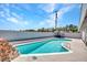 Sparkling backyard pool with surrounding patio, perfect for relaxation and entertainment at 4417 Saint Andrews Cir, Las Vegas, NV 89107